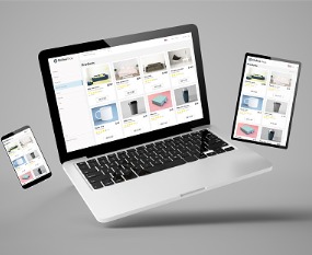 A computer, phone, and tablet with a sample website created by a Web Design Company in Bloomington IL